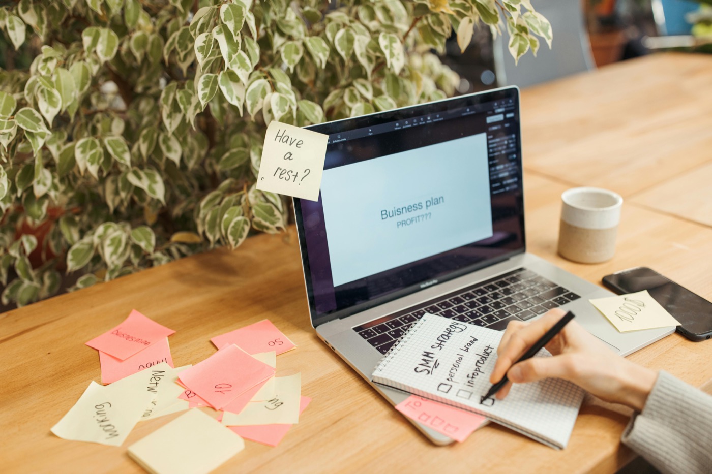 API workflow planning setup with laptop and sticky notes